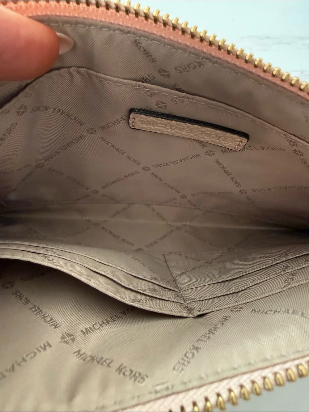 MICHAEL KORS Pebbled Leather Wristlet in baby pink